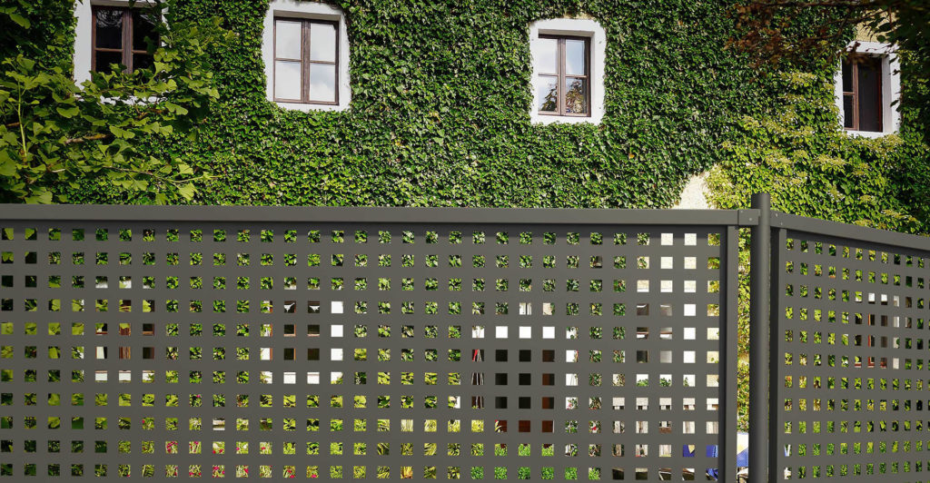 House with vines and a Perforated Plus fence on the outside