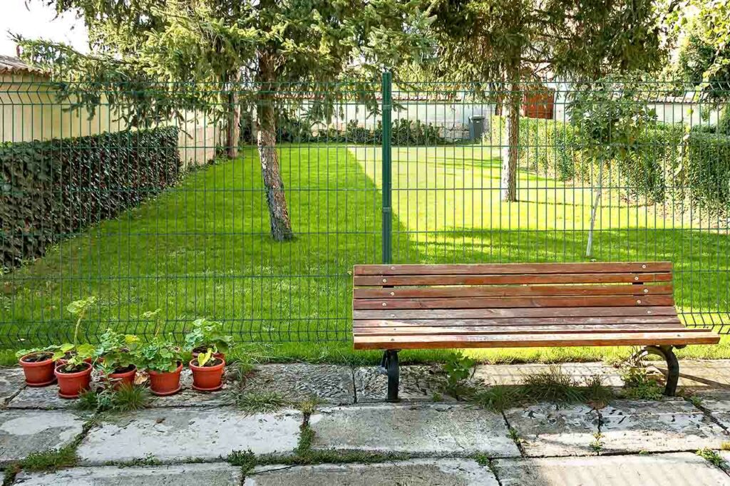 A MRT Eco panel in a private garden with trees