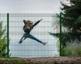 ECO fence in front of a happy girl